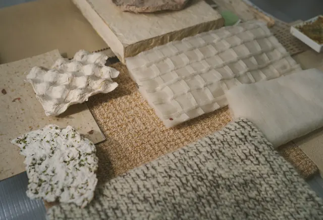 Stone, wool and wood samples on a table
