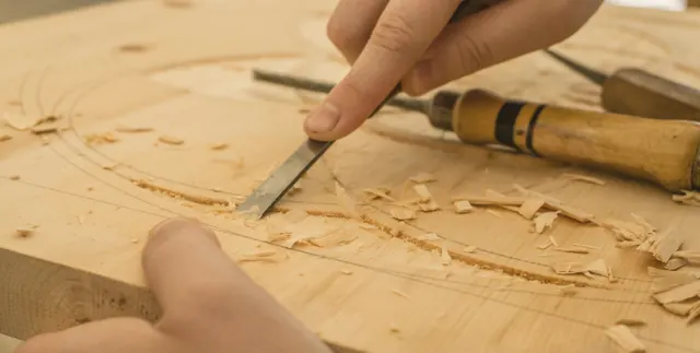Gouge carving a piece of wood