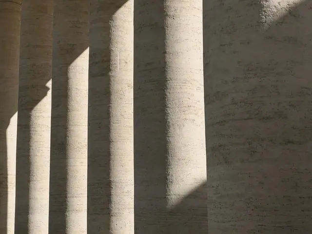 Travertine columns striped with light and shade